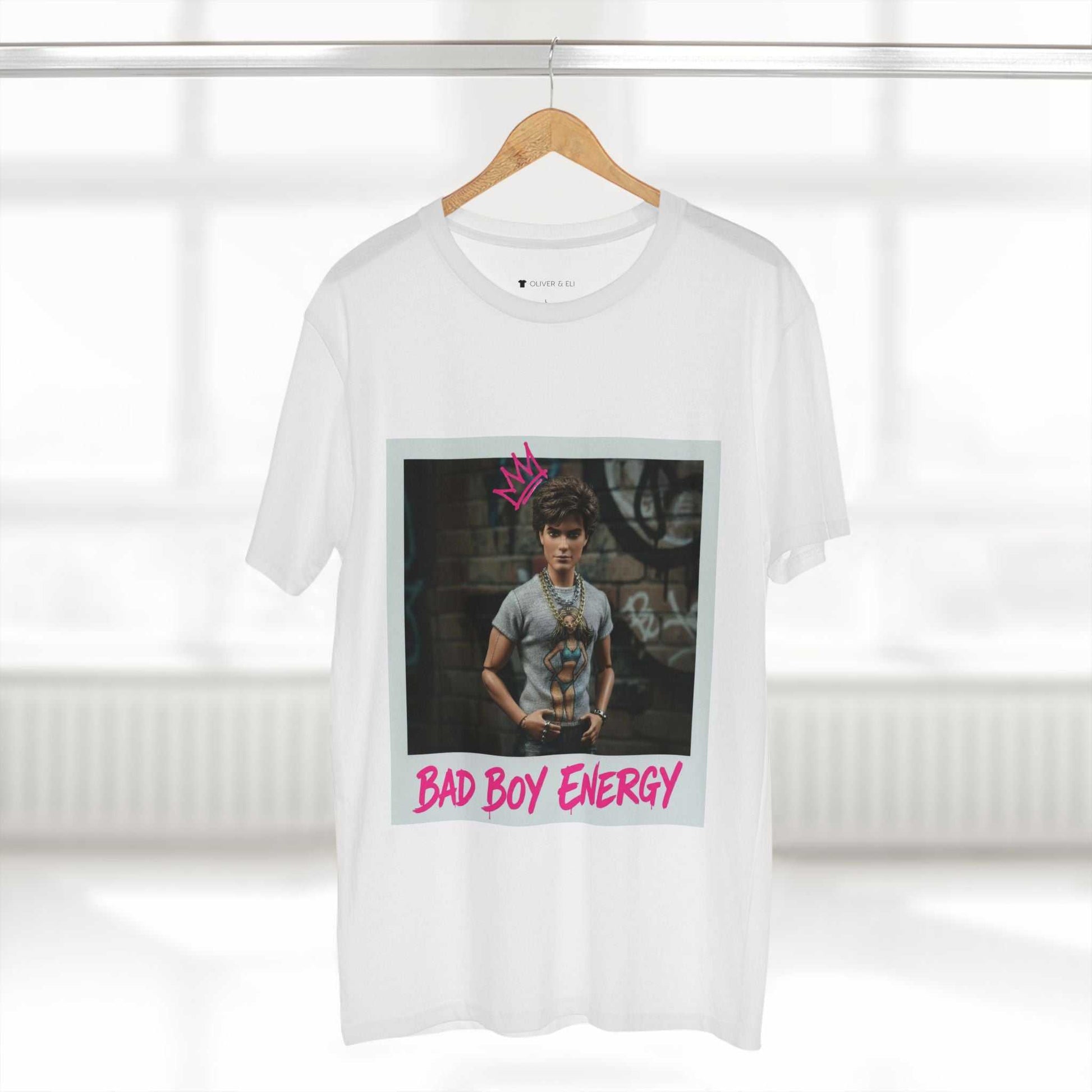 Bad Boy Energy Tee by Oliver & Eli – white cotton t-shirt with graffiti print and bold artistic design.
