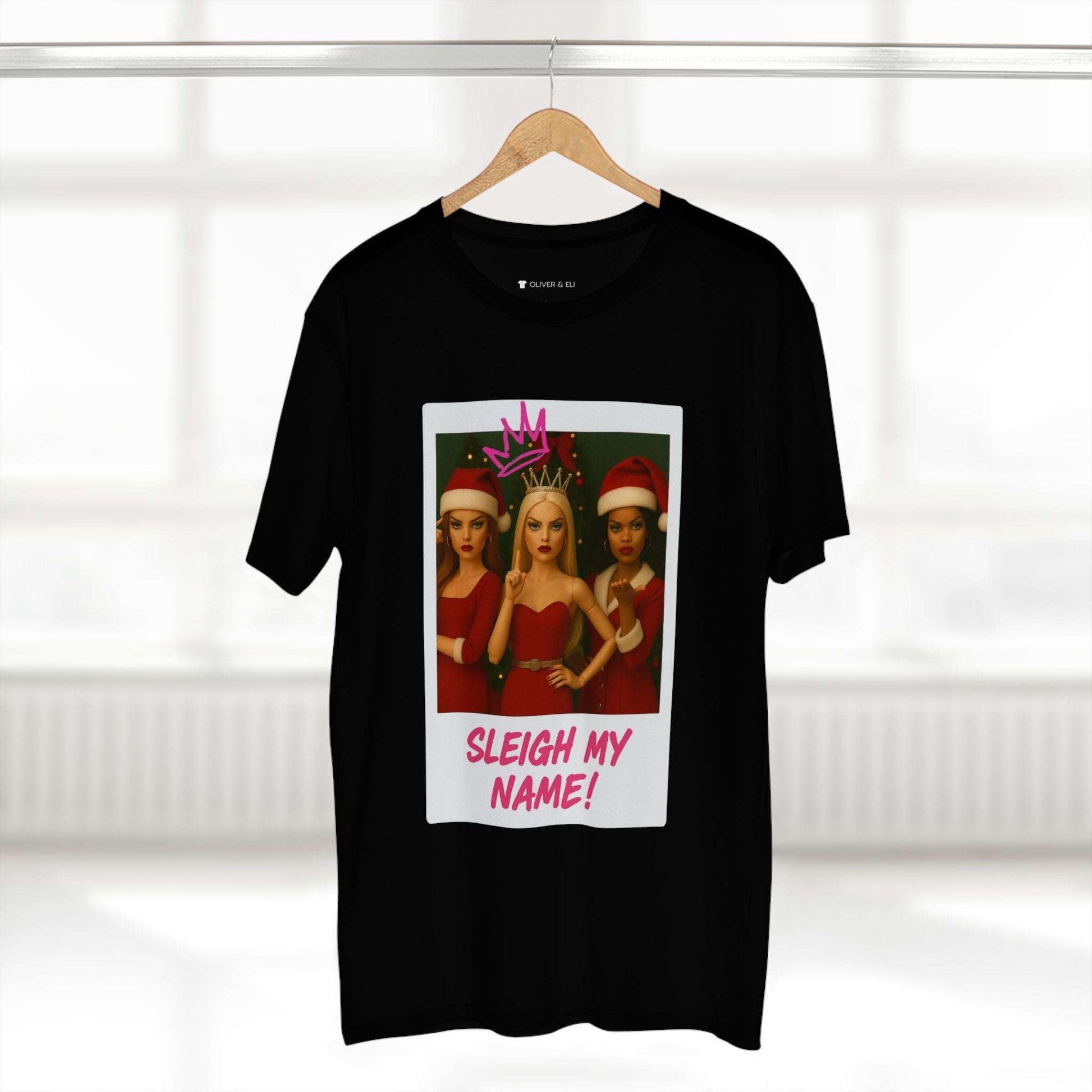 Sleigh My Name Christmas T-shirt featuring three dolls in red outfits with crowns and graffiti text