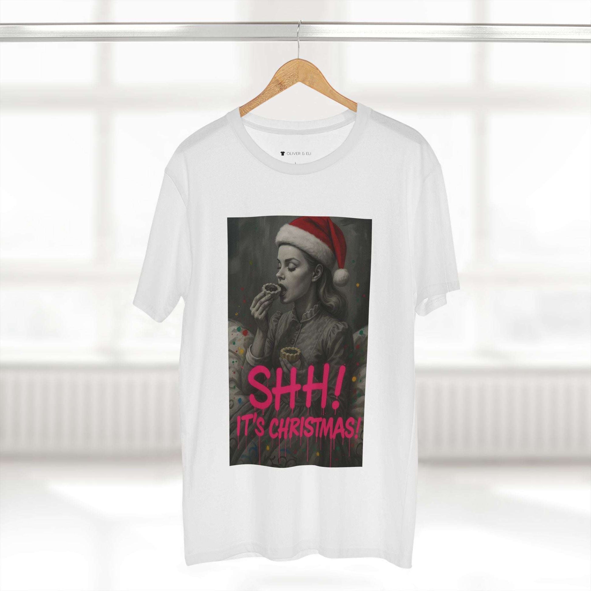 SHH! It’s Christmas T-shirt with grayscale vintage figure in Santa hat and pink graffiti text