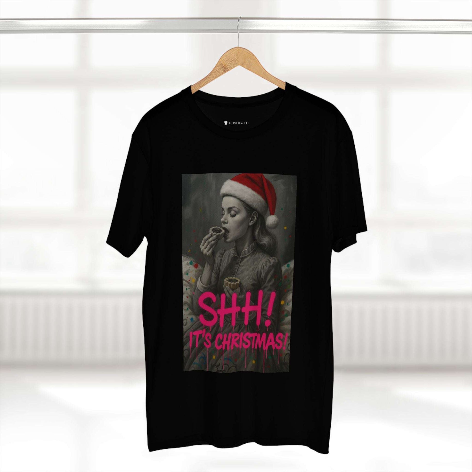 SHH! It’s Christmas T-shirt with grayscale vintage figure in Santa hat and pink graffiti text
