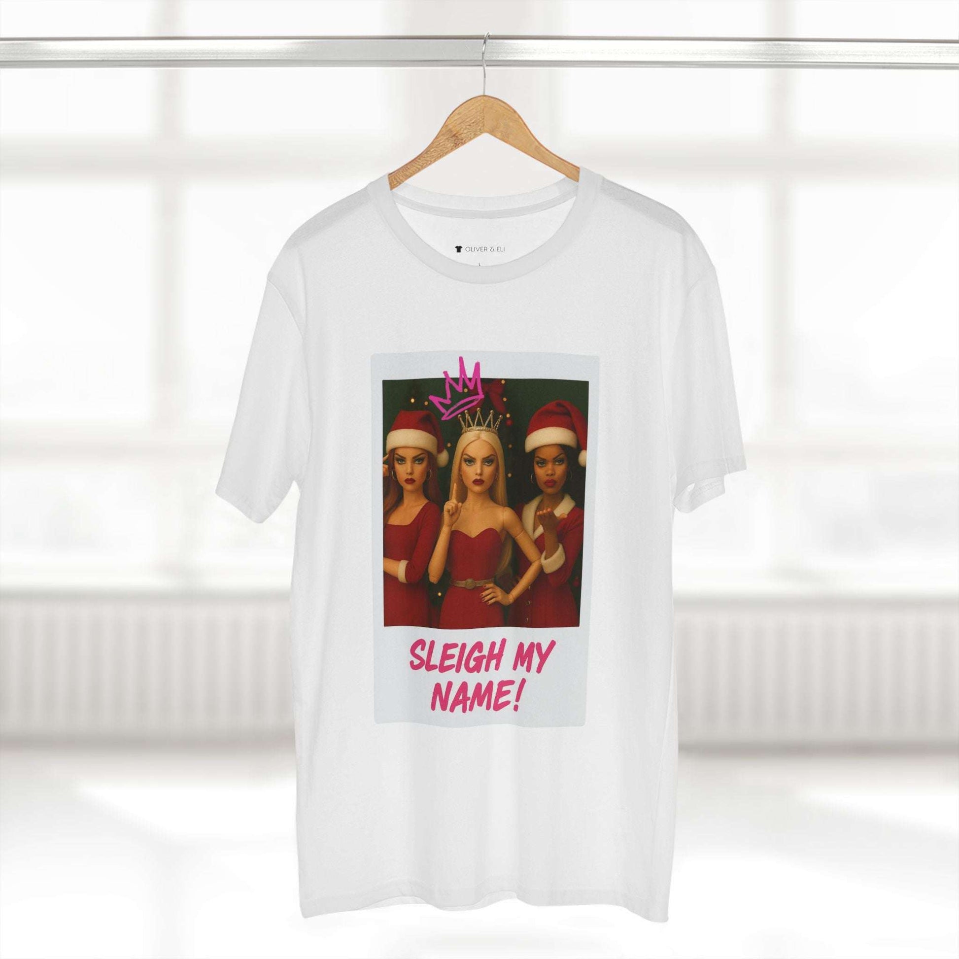 Sleigh My Name Christmas T-shirt featuring three dolls in red outfits with crowns and graffiti text